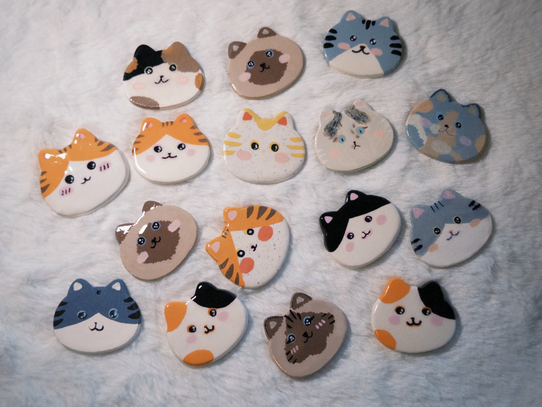 our handmade clay cat magnets: small shapes, small expressions, small moments of joy